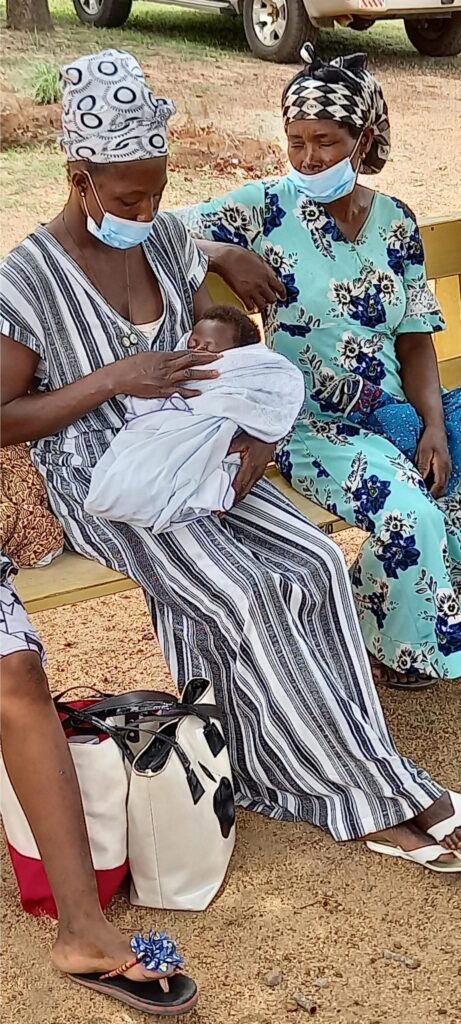Mother cuddling sleeping baby