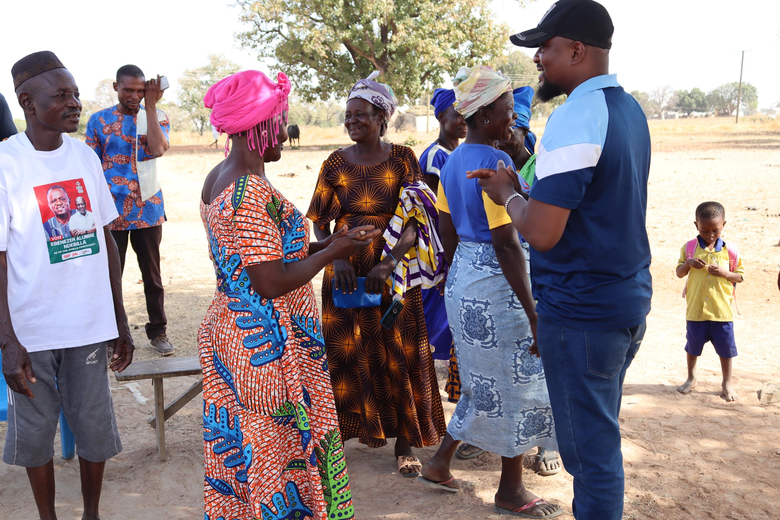 BasicNeeds-Ghana staff meeting community members