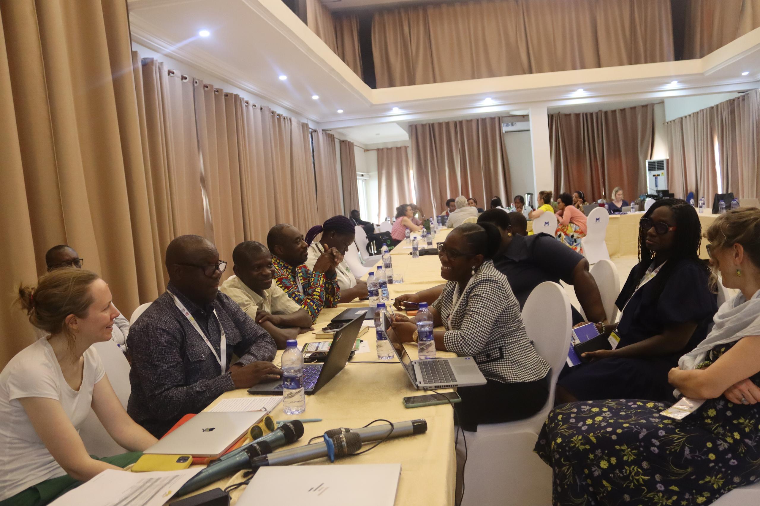 Partners working together at a BasicNeeds-Ghana meeting